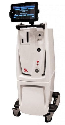 A white machine with red and black buttons.